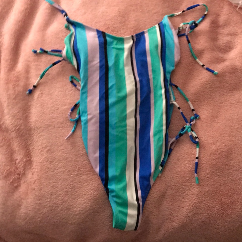 The “holes” are part of the swimsuit